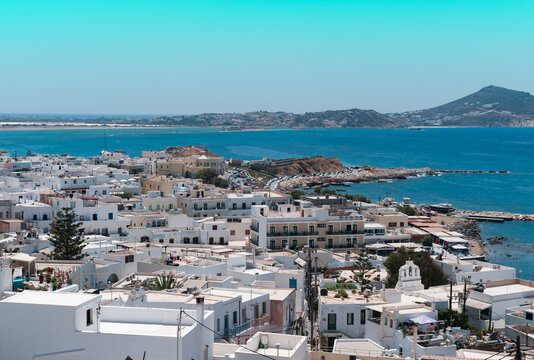 Naxos town view, blue sea, white greek buildings, sunny vacation day, tourism concept