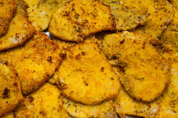 Fried chicken chops in egg batter close-up. Food Textures.