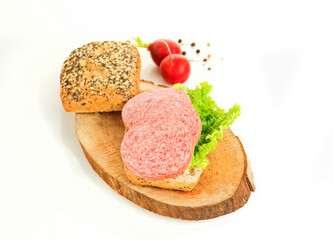 Fototapeta na wymiar salami sandwich on wood