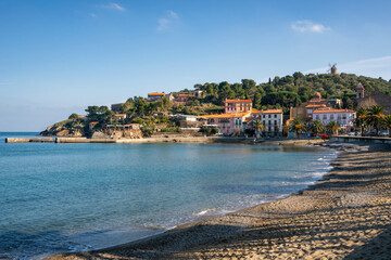 Fototapeta na wymiar Collioure view from the beach with the Mill on the top of the village