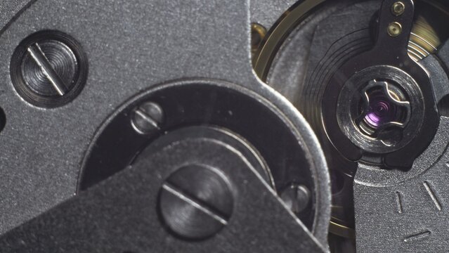 Watch mechanism macro loop. Old vintage clock mechanism working, closeup shot with soft focus. Close up of a internal clock mechanism. Watch gears movement macro. Time Keeping. - Powered by Adobe
