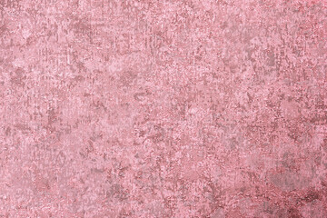 Textured red background with protrusions and dents, a surface of lines and spots