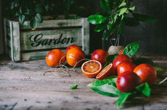 Bunch of blood oranges on table