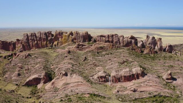 Reddish rock formations in Aramu Muru near Puno in Peru