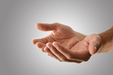 Hands up with asking gesture with gray isolated background