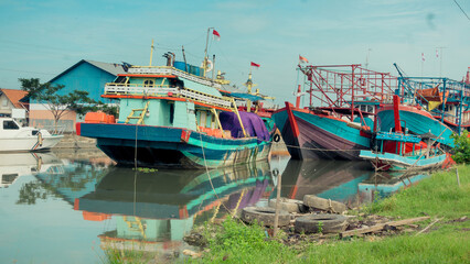 Fototapeta na wymiar Ships are docked at the port city of Tegal, Central Java, on the morning of March 2, 2022.