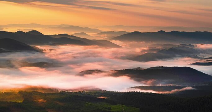 Fog over a mountain valley in the Carpathians at sunrise sweeps with great magical speed. Timelapse - accelerated filming of natural processes.