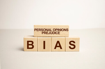 Word BIAS made from wooden blocks on white background