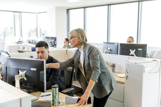 Business People Working At Computer In Office Cubicle