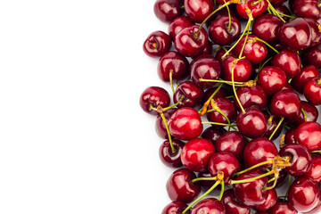 Fresh cherry with stems isolated on white background.