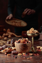 Various dried fruits and nuts on a kitchen table.