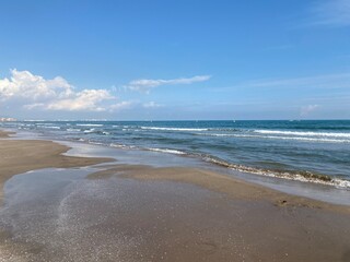 Fototapeta na wymiar Seaside, half-term break, winter sun, beach, vacation, child playing, sand, sea view, Spain, Valencia beach, sunny, October