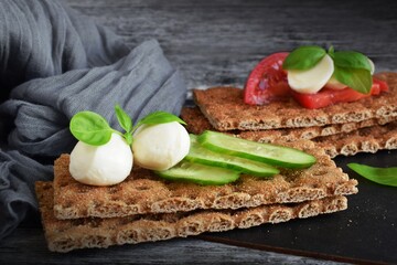 Crispy buckwheat bread with vegetables and mozzarella.Buckwheat crackers.Healthy eating.