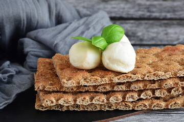 Crispy buckwheat bread with mozzarella and basil.Buckwheat cracker.Healthy eating.