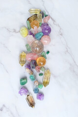 different crystal gemstones close up on marble background. Minerals set for esoteric ritual,...