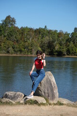 girl going on a nature tour in the green forest The background is a view of the forest. during the day on vacation