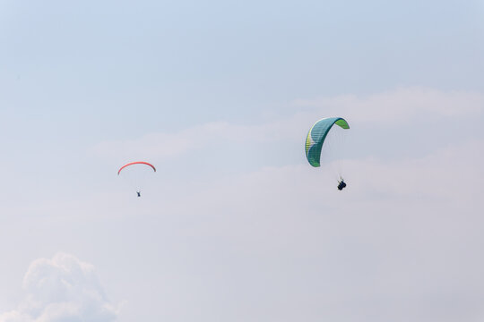 Paraplaners with beautiful blue sky and clounds in the background