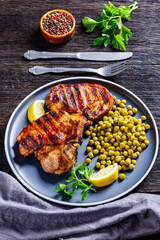 grilled pork t-bone steaks with boiled green peas