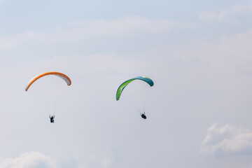 Paraplaners with beautiful blue sky and clounds in the background