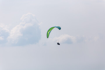 Paraplaners with beautiful blue sky and clounds in the background