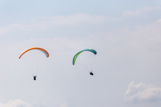 Paraplaners with beautiful blue sky and clounds in the background