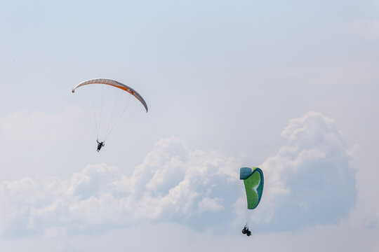 Paraplaners with beautiful blue sky and clounds in the background