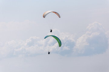 Paraplaners with beautiful blue sky and clounds in the background