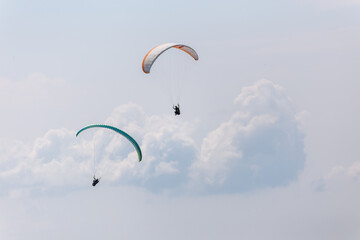 Paraplaners with beautiful blue sky and clounds in the background