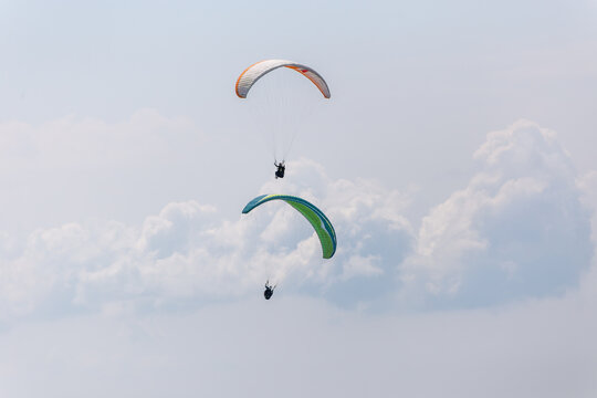 Paraplaners with beautiful blue sky and clounds in the background