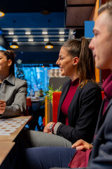 Laughing together while sitting in the cafe, close up