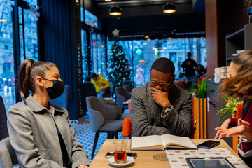 Laughing and sitting in the cafe