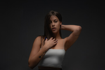 Posing seductivly while touching herself