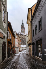 Cesky Krumlov,Czech Republic.Empty snowy street of famous Czech medieval town.Historic centre with Gothic,Renaissance,Baroque architecture and castle.UNESCO heritage site.Urban monument reservation.
