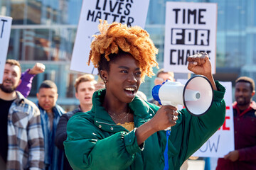 Protestors With Placards And Megaphone On Black Lives Matter Demonstration March Against Racism - obrazy, fototapety, plakaty