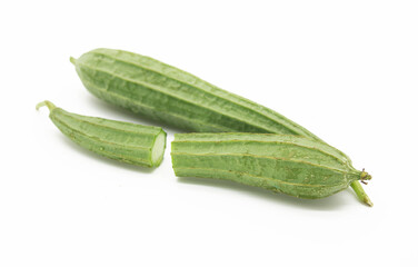 Fresh ridged gourd luffa on white background.