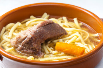 beef bouillon with carrot and noodles