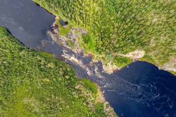 Bird’s eye view of Yama (Pit) rapid on Tuntsayoky river on sunny summer day. Murmansk Oblast, Russia.