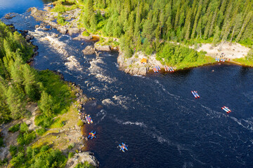 Drone view of catamarans near by Yama (Pit) rapid on Tuntsayoky river on sunny summer day. Murmansk...