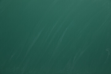 Dirty green chalkboard as background. School equipment