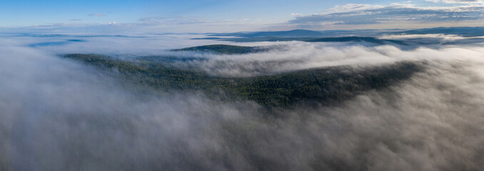 Panoramic aerial view of the fog over the forest. Murmansk Oblast, Russia.
