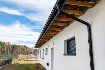 Roof trusses through which the electric cable passes to connect the lighting in the soffit.
