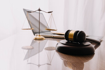 Male lawyer working with contract papers and wooden gavel on tabel in courtroom. justice and law ,attorney, court judge, concept.