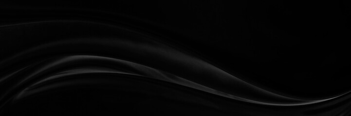 Black gray satin dark fabric texture luxurious shiny that is abstract silk cloth panorama background with patterns soft waves blur beautiful.