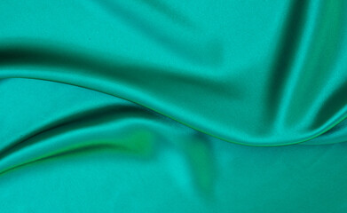 White green satin texture that is white silver fabric silk background with beautiful soft blur pattern natural.