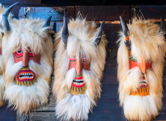 Traditional romanian hand made masks souvenirs at the weekly market in Bran Castle, Romania - obrazy, fototapety, plakaty