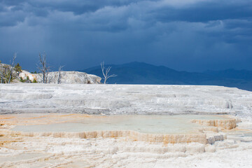 A storm brewing over Travertine terraces at Main Terrace, Mammoth Hot Springs, Yellowstone National Park

