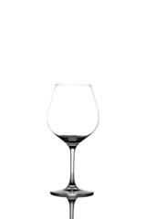an empty wine glass stands on a white background