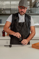 Coffee shop employee (barista) prepare a coffee cup whit a italian coffee maker