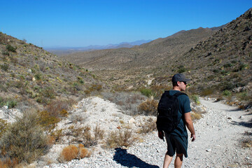 man with backpack hiking in the mountains, Texas