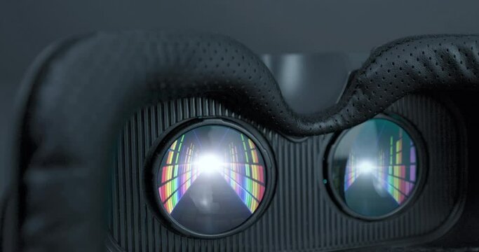 Virtual reality glasses shows digital colored internet tunnel animation. Futuristic VR AR metaverse world